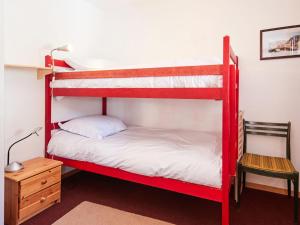 a bedroom with two bunk beds and a desk at Apartment Arzinol 106 by Interhome in Les Collons