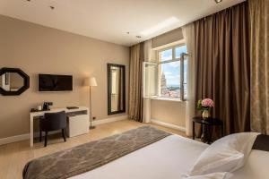 Krevet ili kreveti u jedinici u okviru objekta Cornaro Hotel