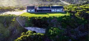 an aerial view of a house on a hill at Seebederfie in Groot Brak Rivier