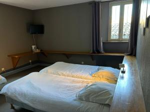 Postel nebo postele na pokoji v ubytování Auberge du désert
