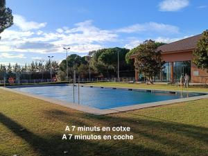 a pool in a park with the words at minutes an cycle at minutes at Can Joan Empordà in Ordis