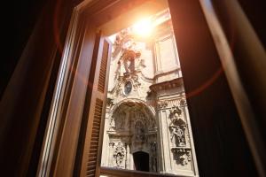 a view of a building through a window at Hotel Atari in Donostia-San Sebastián