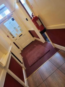 an overhead view of a room with a door and a floor at Victoria Guest House in Stoke on Trent