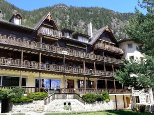 a large house with balconies on the side of it at Apartment Résidence 25 by Interhome in Champex
