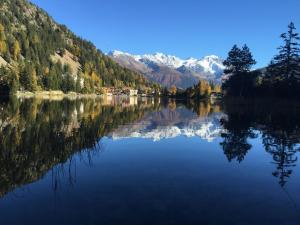 a view of a lake with mountains in the background at Apartment Résidence 25 by Interhome in Champex