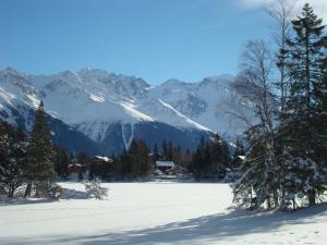 a snow covered mountain range with a ski slope at Apartment Résidence 25 by Interhome in Champex