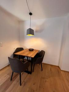 a dining room with a wooden table and chairs at Apartment Family 03 by Interhome in Söll +29 photos