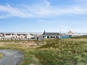 a view of a beach with houses and a road at Holiday Home Unge - 75m from the sea in NW Jutland by Interhome in Torsted