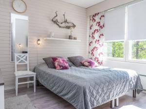 En eller flere senge i et værelse på Holiday Home Moitakuru a17 by Interhome