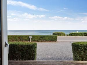 a view of the ocean from a door at Apartment Caisa - 75m from the sea in Bornholm by Interhome in Allinge
