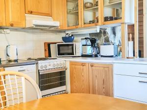 Kuchyň nebo kuchyňský kout v ubytování Holiday Home Vuonelo 8 a 2 by Interhome + 17 fotografií