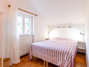 Postel nebo postele na pokoji v ubytování Apartment Punta Grumo 2 by Interhome
