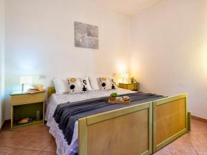 A bed or beds in a room at Apartment L'Oasi Bilo A1 by Interhome