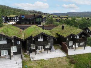 an overhead view of a house with a grass roof at Holiday Home Hovden - SET086 by Interhome in Hovden