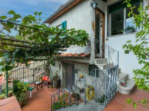 a balcony of a house with a staircase at Apartment La casa del Fale di Collodi by Interhome in Collodi +40 photos