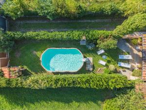 an overhead view of a swimming pool in a yard at Holiday Home Oleandro by Interhome in Camaiore