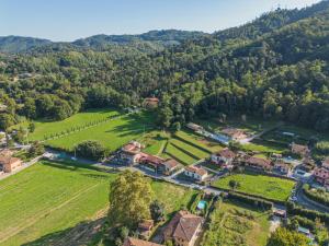 an aerial view of a estate with a farm and trees at Holiday Home Oleandro by Interhome in Camaiore