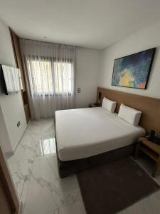 Posteľ alebo postele v izbe v ubytovaní Twin Hotel Tanger
