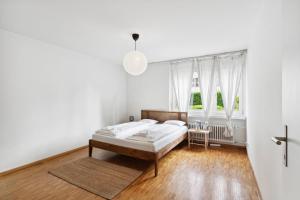 Giường trong phòng chung tại Beautiful Boutique Apartment DRAHTZUG14
