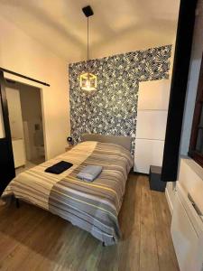 a bedroom with a large bed in a room at T1 in Toulouse