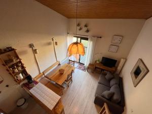 an overhead view of a living room with a couch and a table at Appartement Enchastrayes, 2 pièces, 6 personnes - FR-1-165A-132 in Enchastrayes