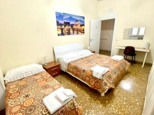 A bed or beds in a room at Palazzo Senesi