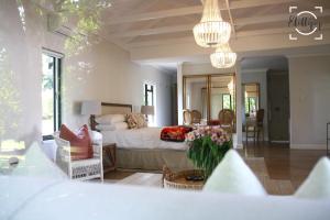 a bedroom with a bed and a living room at Harrington House in Hilton