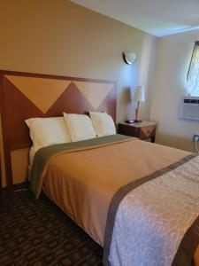 Ένα ή περισσότερα κρεβάτια σε δωμάτιο στο M Star Hotel Mansfield