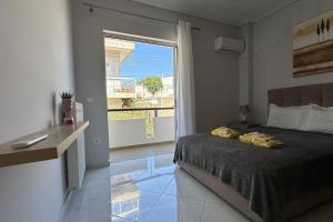 a bedroom with a bed and a large window at Redamancy - PERI009 in Athens