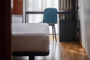 A bed or beds in a room at Silken Sant Gervasi