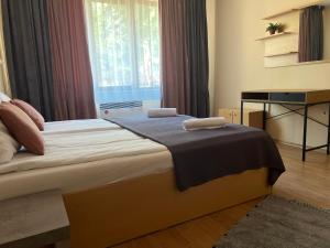 Postel nebo postele na pokoji v ubytování Minkov Apartments, Замъка 2