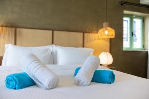 DOMS Boutique Living客房内的一张或多张床位