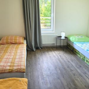 Postel nebo postele na pokoji v ubytování Apartmány U stezek