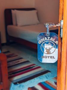 a key tag on a door to a hotel room at Ghazala Oasis Dahab in Dahab