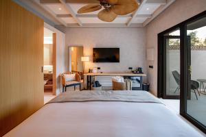 Tempat tidur dalam kamar di Hotel Boutique Cigarral de las Mercedes
