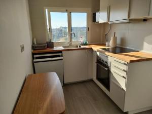 a kitchen with a sink and a counter top at Apartamento vacacional en Denia in Denia +6 photos