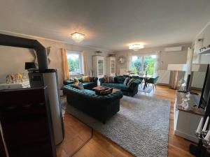 a living room with two couches and a table at Dreamliner in Sassnitz