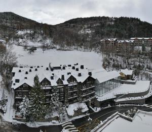 an aerial view of a resort in the snow at Aparthotel AnyosPark Mountain & Wellness Resort in Anyós
