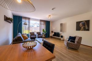 a living room with a table and a couch at Hermanus Boexstraat in Eindhoven