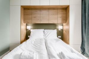 Posteľ alebo postele v izbe v ubytovaní Rent like home - Dwie Motławy III z parkingiem