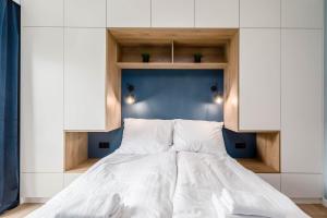 Posteľ alebo postele v izbe v ubytovaní Rent like home - Dwie Motławy III z parkingiem
