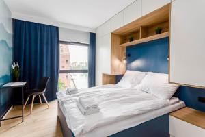 Posteľ alebo postele v izbe v ubytovaní Rent like home - Dwie Motławy III z parkingiem