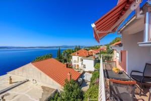 an image of a house with a view of the water at Apartment Davor in Dramalj