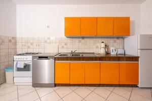 Kuchyň nebo kuchyňský kout v ubytování Apartments Antonio