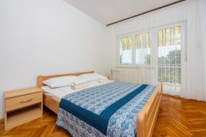 Postel nebo postele na pokoji v ubytování Apartments Antonio