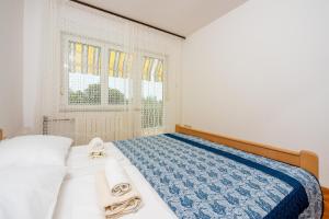 Postel nebo postele na pokoji v ubytování Apartments Antonio