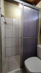 a bathroom with a shower with a toilet at Cabana Casa Enxaimel in Picada Cafe