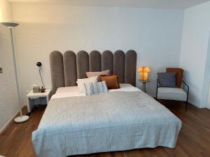 Postel nebo postele na pokoji v ubytování B&B Biel-Brügg
