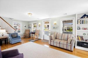 a living room with a couch and a table at Glades Manor: Minot Beach Scituate in Scituate