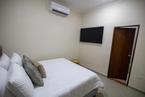 Cama ou camas em um quarto em Casa Palmar Cartagena